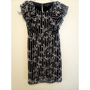 Black dress with bows.